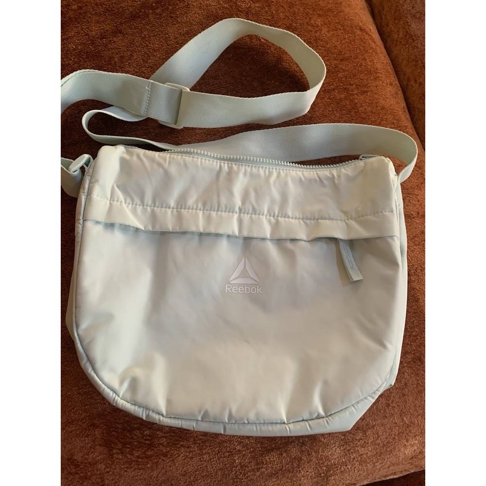 Reebok Crossbody Bag Has A Light Green Tint To It